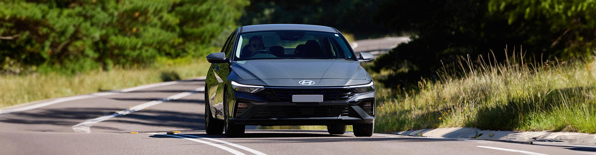 Hyundai i30 Sedan Hybrid 2024 on road