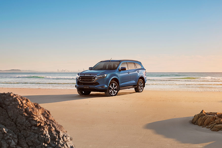 2024 Isuzu MU-X SUV parked on the beach